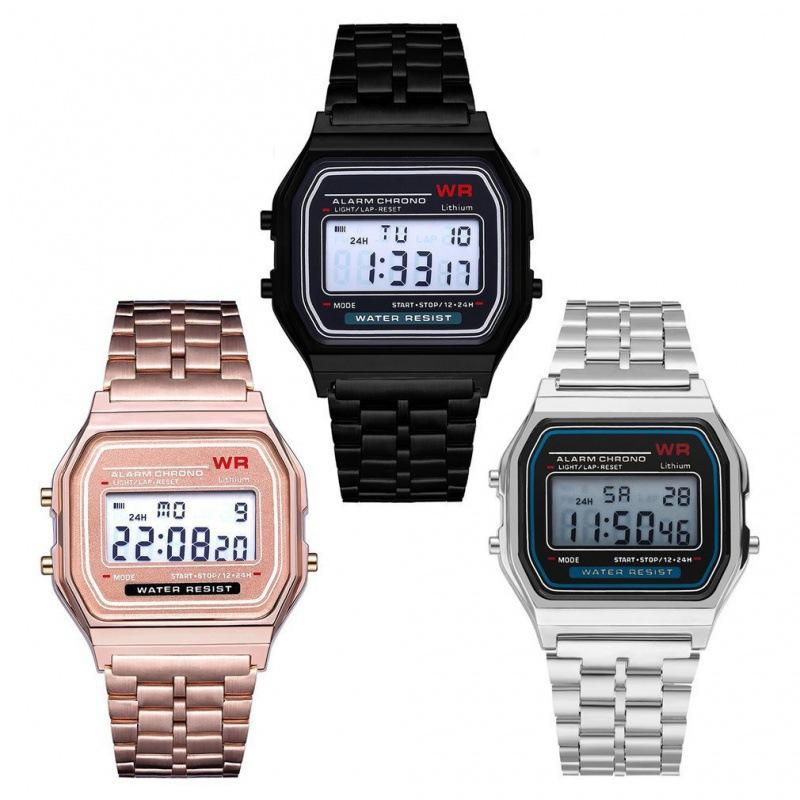 Three digital watches in black, rose gold, and silver on a white background