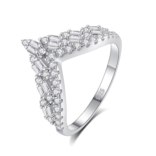Silver ring with diamond accents on a white background