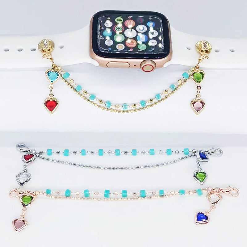 Smartwatch with colorful beaded bracelets on a white surface
