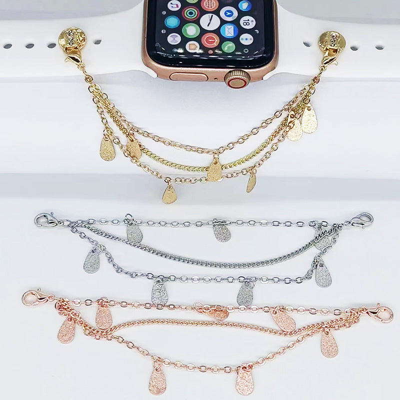 Three gold, silver, and rose gold bracelets with teardrop charms on a white surface.