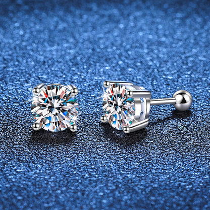 Pair of diamond stud earrings on a blue textured background