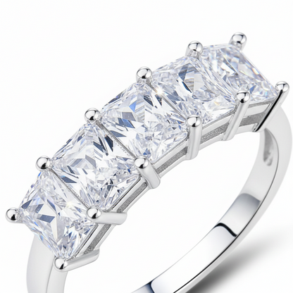 A five-stone diamond ring with princess-cut clear gemstones in a silver-colored metal setting, shown on a clean white background.