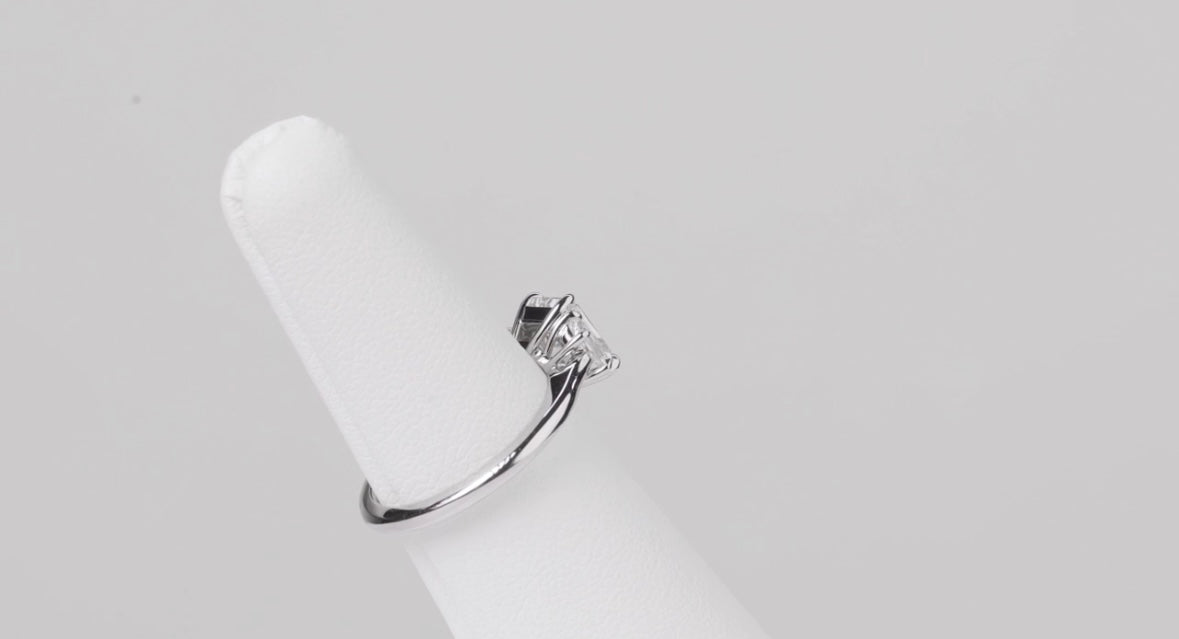 A side profile of a Moissanite ring on a side profile display 