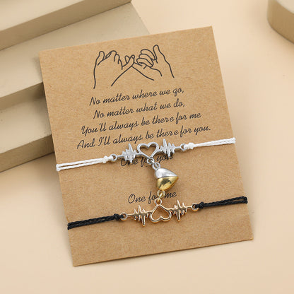 Bracelet with heart and bell charms on a brown card with text