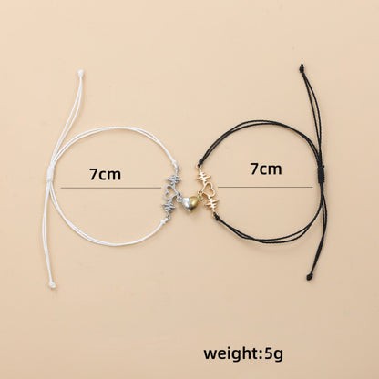 Two bracelets, one white and one black, with measurements and weight displayed on a beige background.