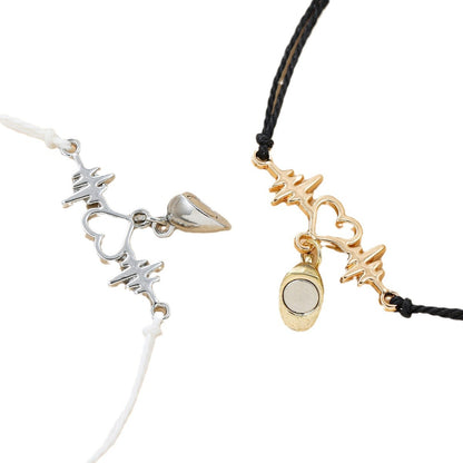 Two necklaces with charms on a white background