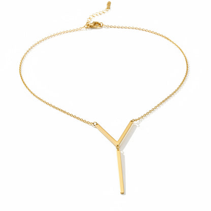 Gold necklace with a V-shaped pendant on a black background