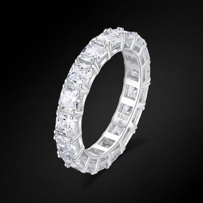 Silver ring with multiple diamonds on a white background