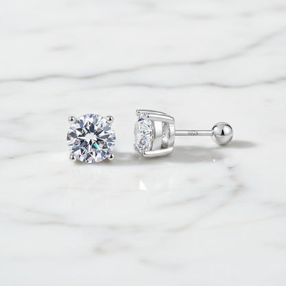 Pair of silver stud earrings with clear gemstones on a white background