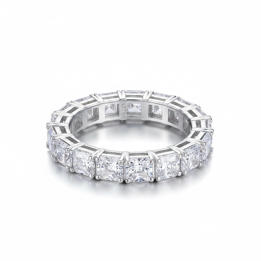 Second placed ring flat no reflection  Silver ring with multiple diamonds on a white background