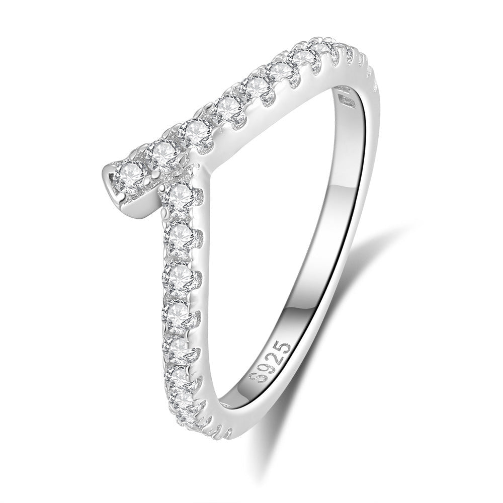 Silver lining ring with diamond accents on a white background