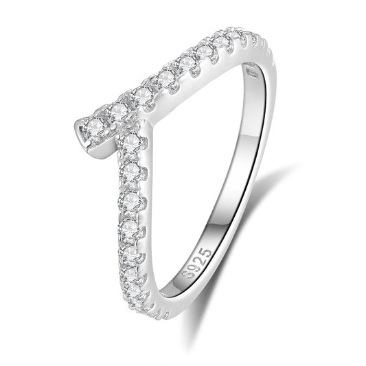 Silver lining ring with diamond accents on a white background