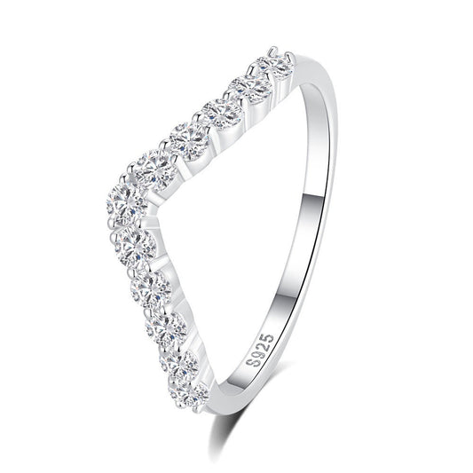 A silver triangular ring with a row of clear round-cut stones along the front edge, shown on a clean white background. The inner band is stamped with 'S925'.