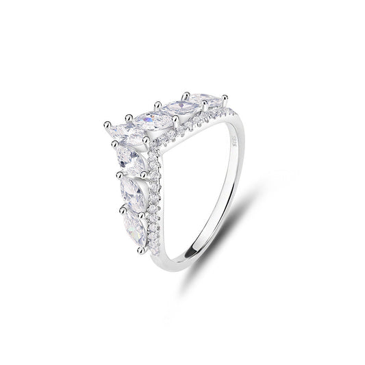Silver ring with multiple gemstones on a white background