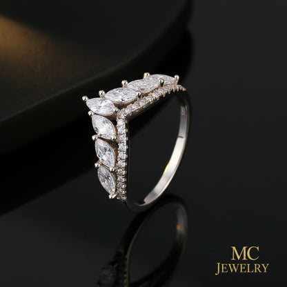 Silver ring with multiple gemstones on a white background