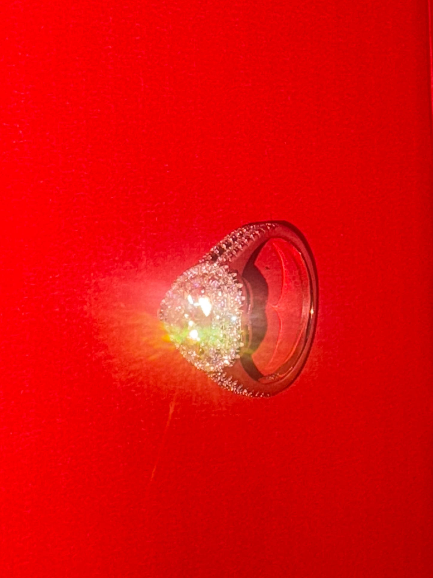 Sparkling ring on a red background