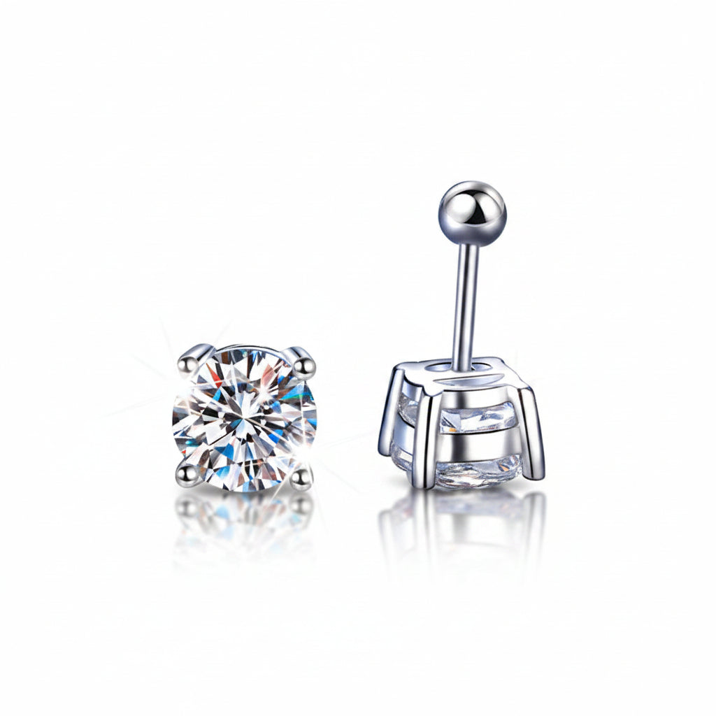 Two_silver_earrings_with_clear_gemstones_on_a_blue_textured_background