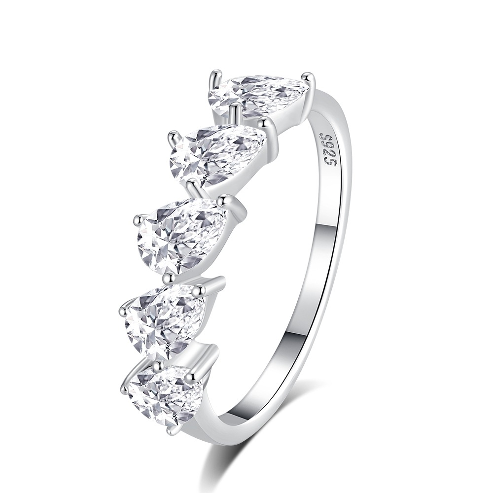 Silver ring with clear gemstones on a white background
