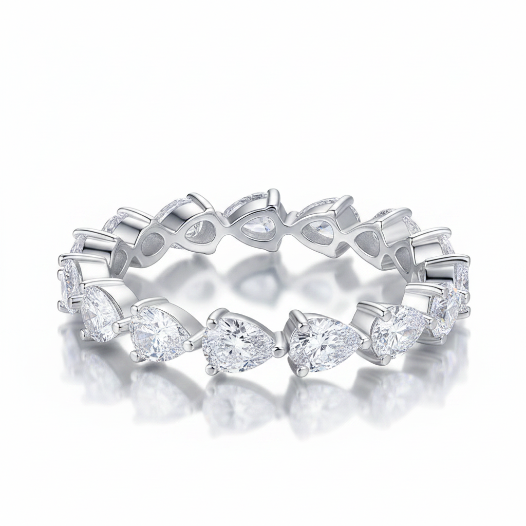 Silver ring with heart-shaped gemstones on a white background
