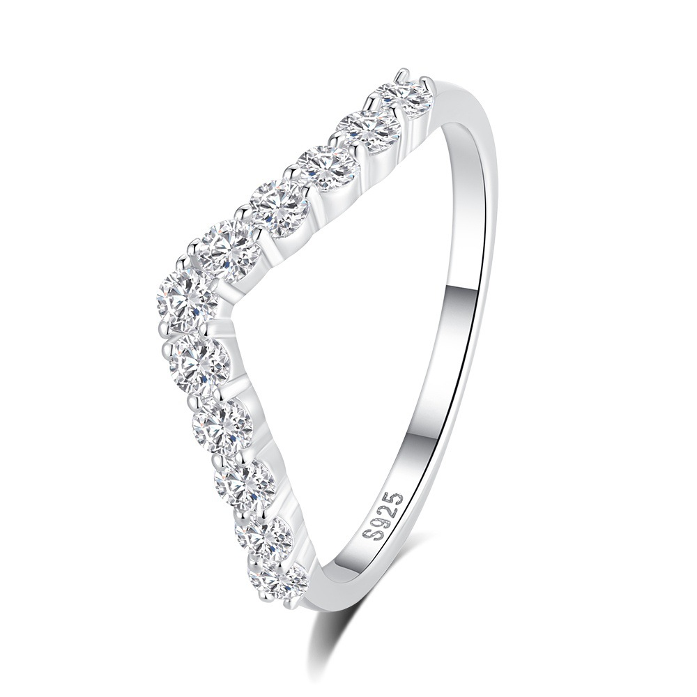 Silver ring with diamonds on a white background