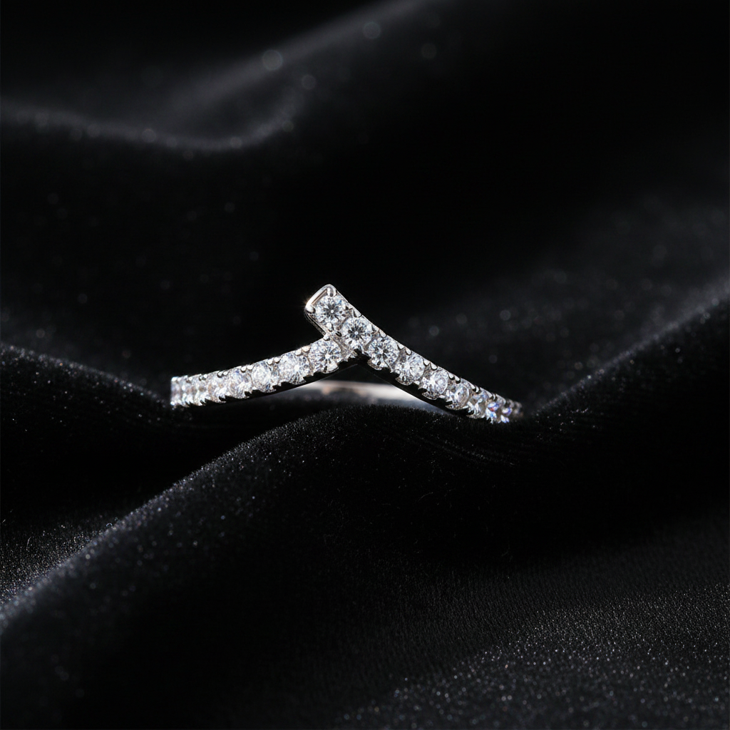 Diamond earring on a black fabric background