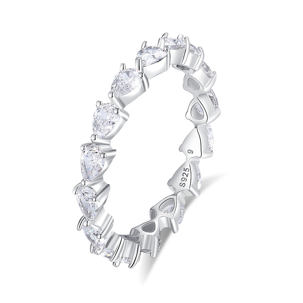 Silver ring with heart-shaped gemstones on a white background