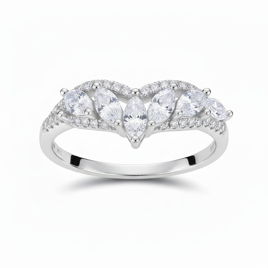 Silver ring with pear-shaped diamonds on a white background