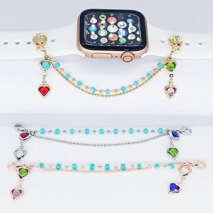 Smartwatch with colorful beaded bracelets on a white surface